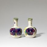 William Moorcroft Pair of 'Pansy' miniature vases, circa 1915