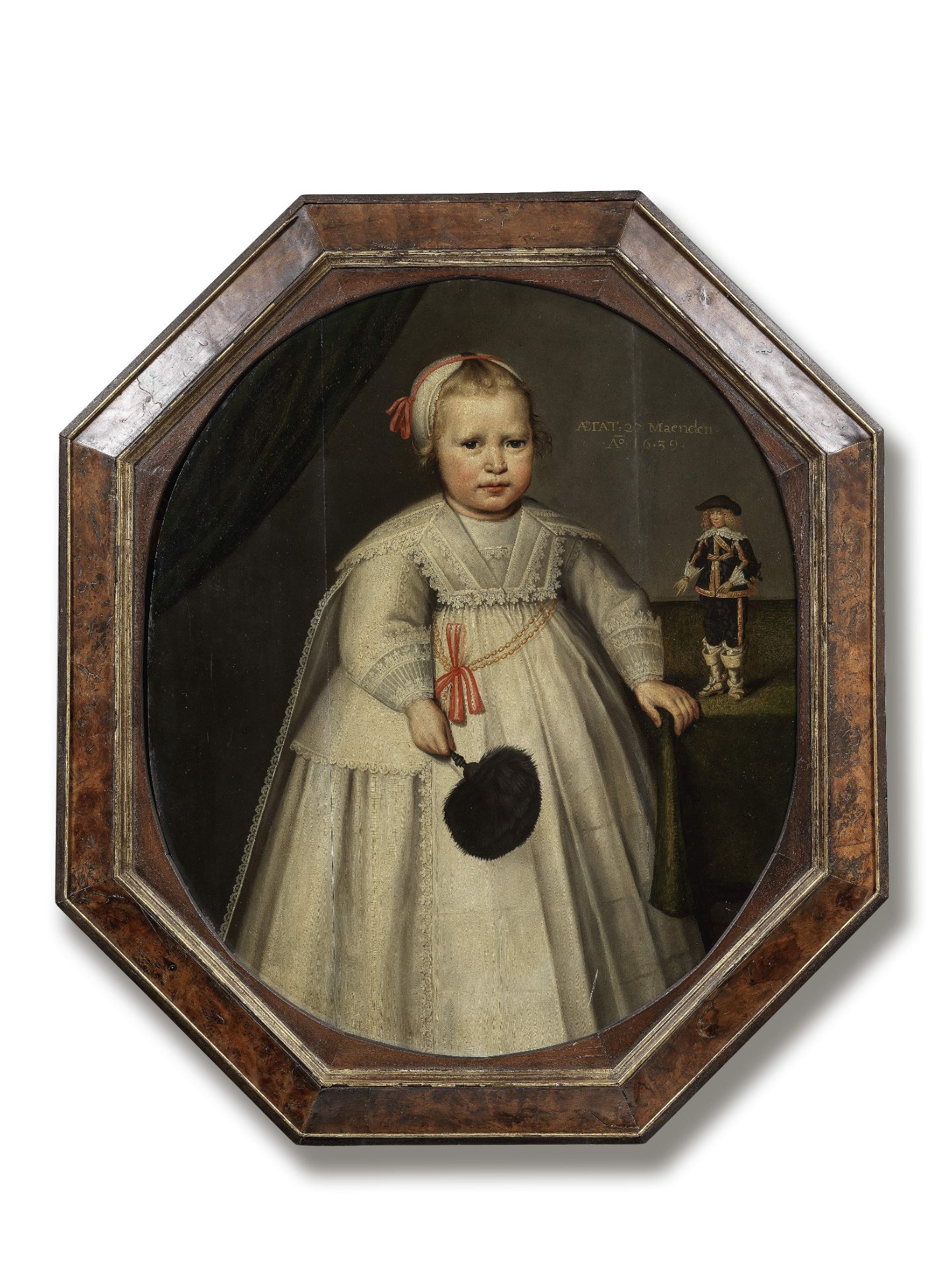 Dutch School, 1639 Portrait of a child, full-length, in white costume, with a male figurine