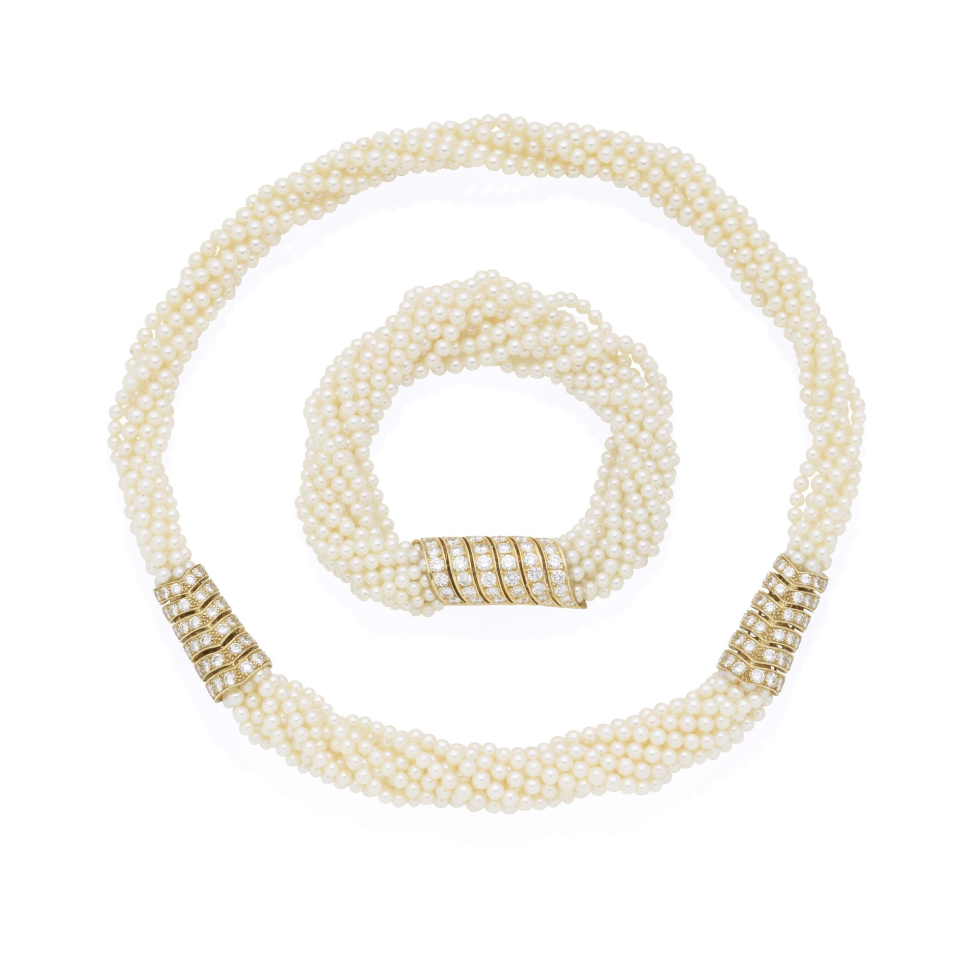 CARTIER: DIAMOND AND SEED PEARL TORSADE NECKLACE AND BRACELET SUITE, 1988