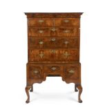 A George I walnut chest on stand