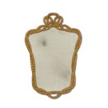 A carved giltwood cartouche-shaped mirror