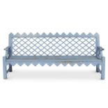 A large pale blue painted garden seat