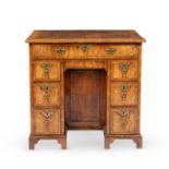 A George I walnut kneehole desk or dressing-table