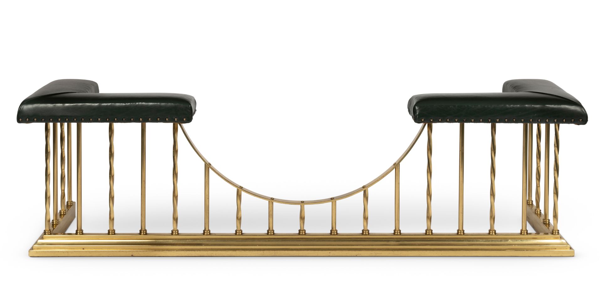 A brass and green leather upholstered club fender