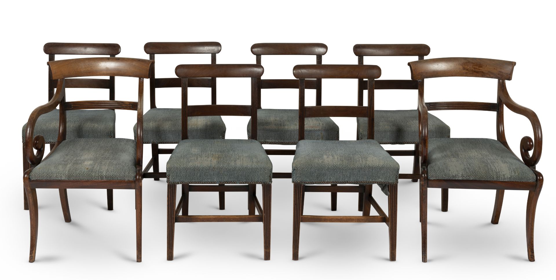 A set of six late George III mahogany dining chairs, together with a matched pair of armchairsEar...