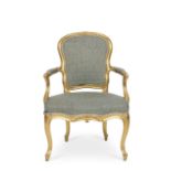 An 18th century carved giltwood fauteuilProbably George III in the Louis XV style