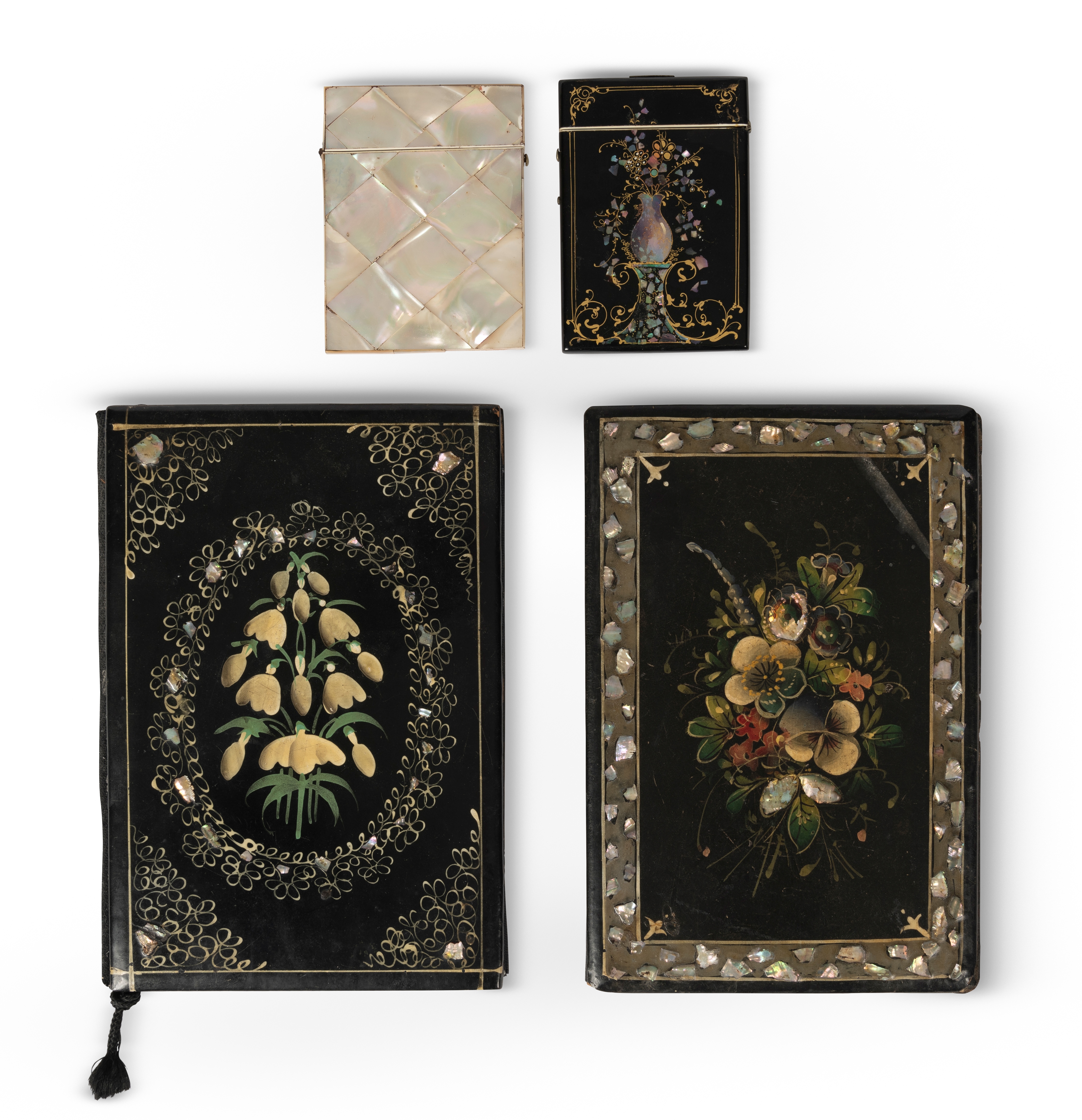 A Victorian papier m&#226;ch&#233; ebonised, floral painted and mother-of-pearl inlaid blotter (6)