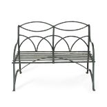 A wrought iron green painted garden seat, together with two matching garden chairs (3)