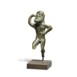 An Etruscan bronze figure of a dancing satyr