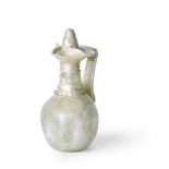 A Roman colourless glass jug with biconical stopper