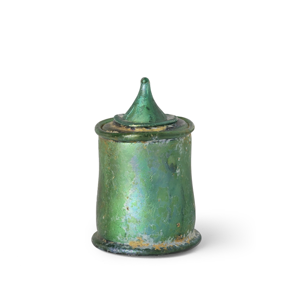 A Roman emerald green glass lidded pyxis