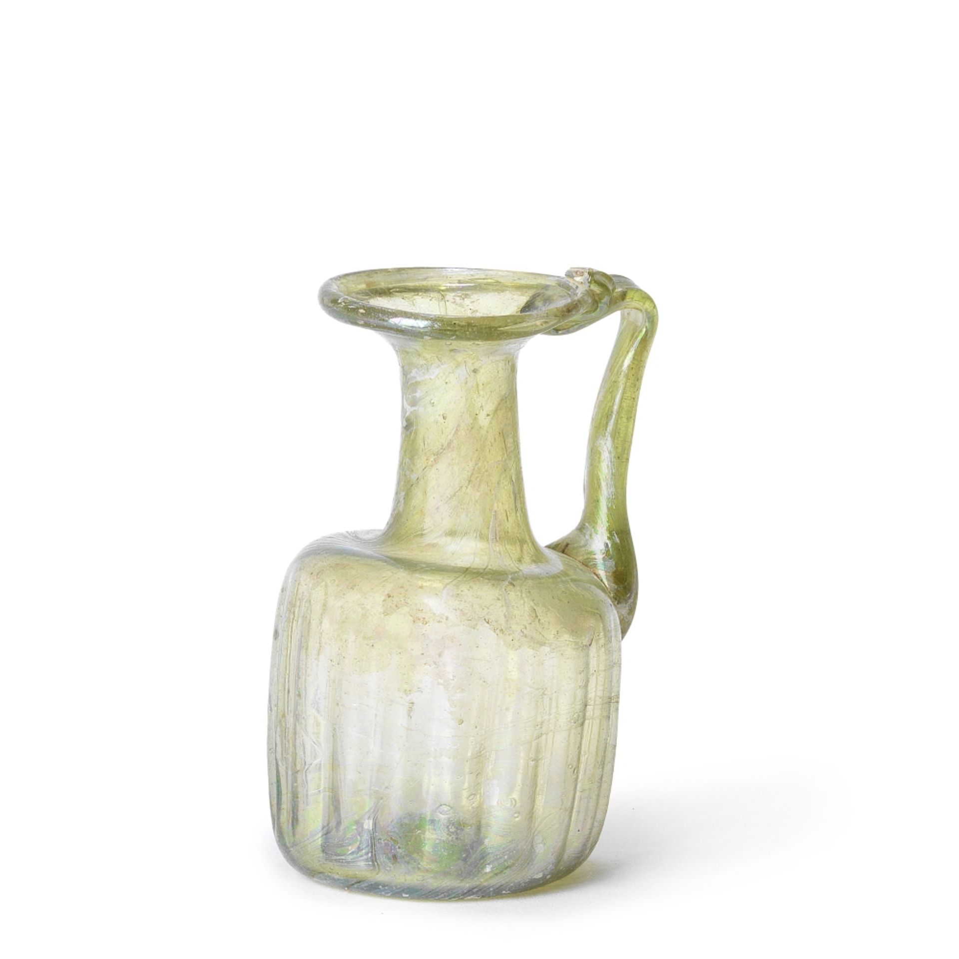 A Roman pale green glass juglet