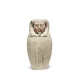 An Egyptian limestone canopic jar
