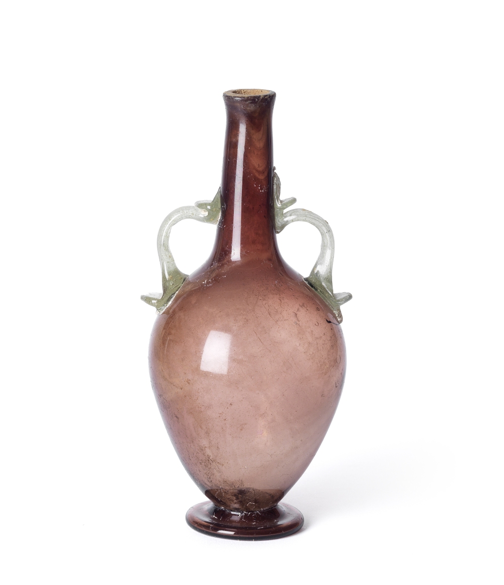 A Roman aubergine glass amphora