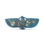 An Egyptian bright blue glazed faience winged scarab