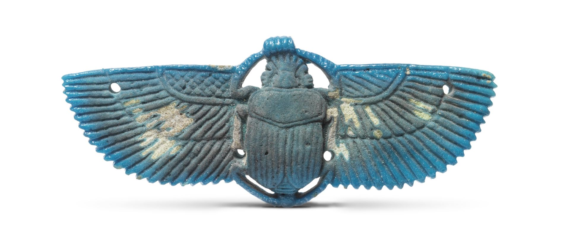 An Egyptian bright blue glazed faience winged scarab