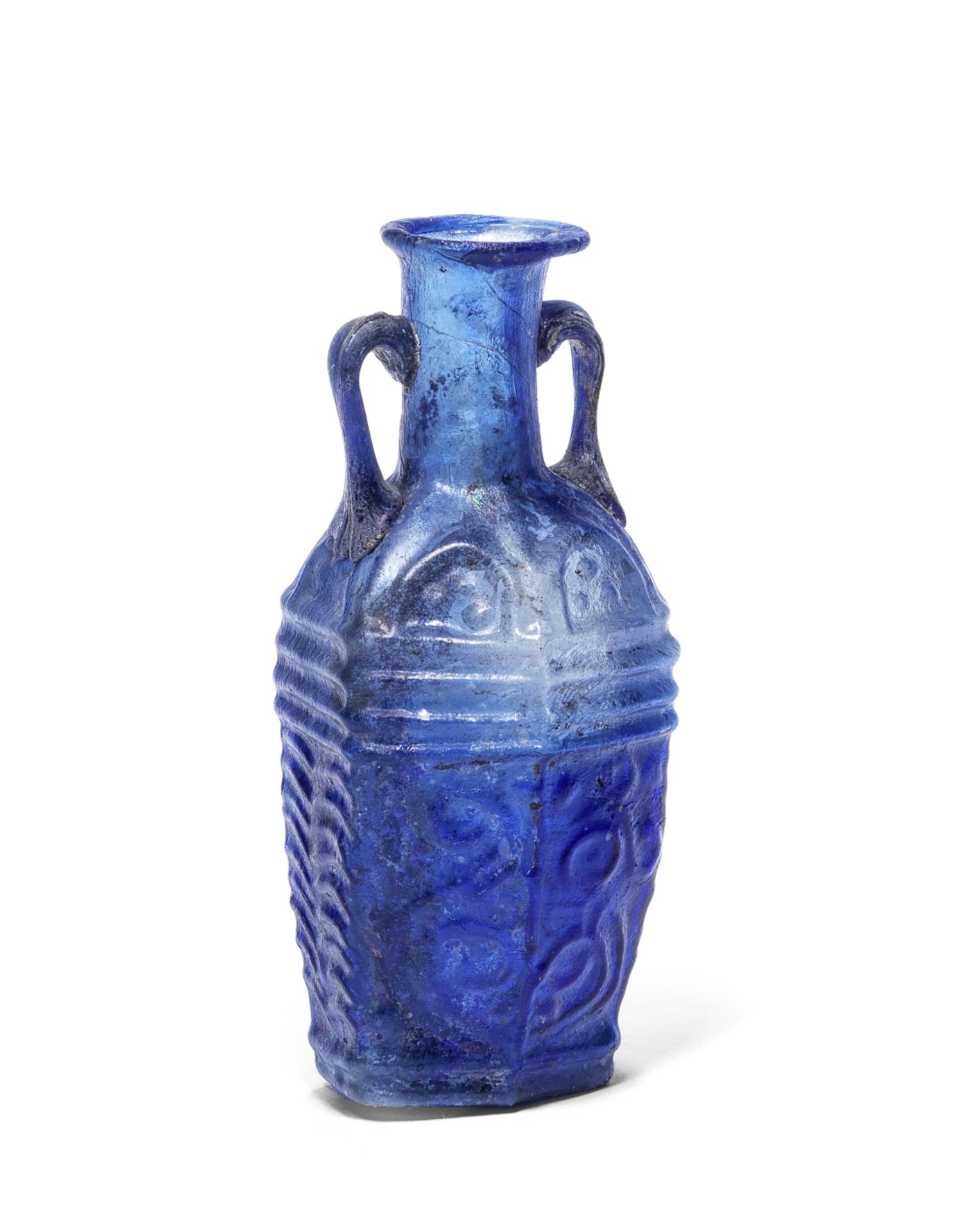 A Roman royal blue glass hexagonal bottle