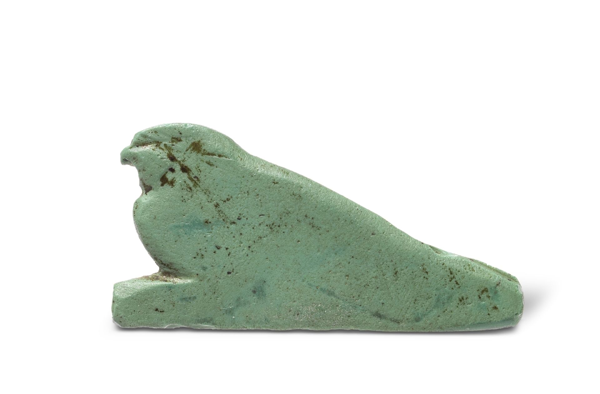 An Egyptian green-blue glass inlay of the Horus falcon