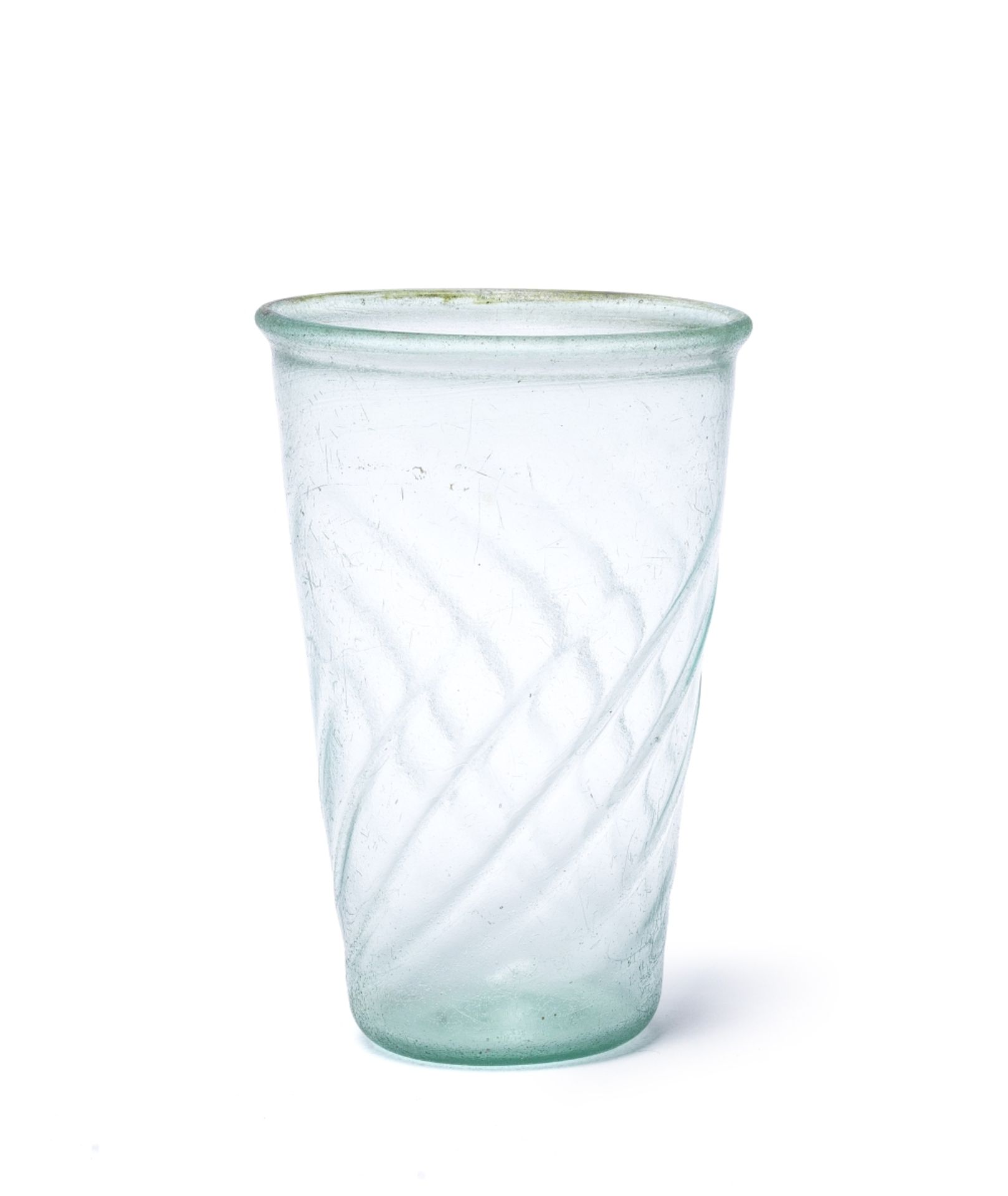 A Roman pale blue-green glass ribbed beaker