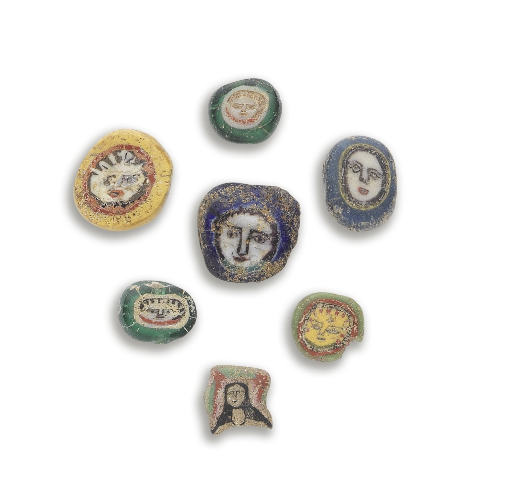 A group of seven Roman glass face beads 7