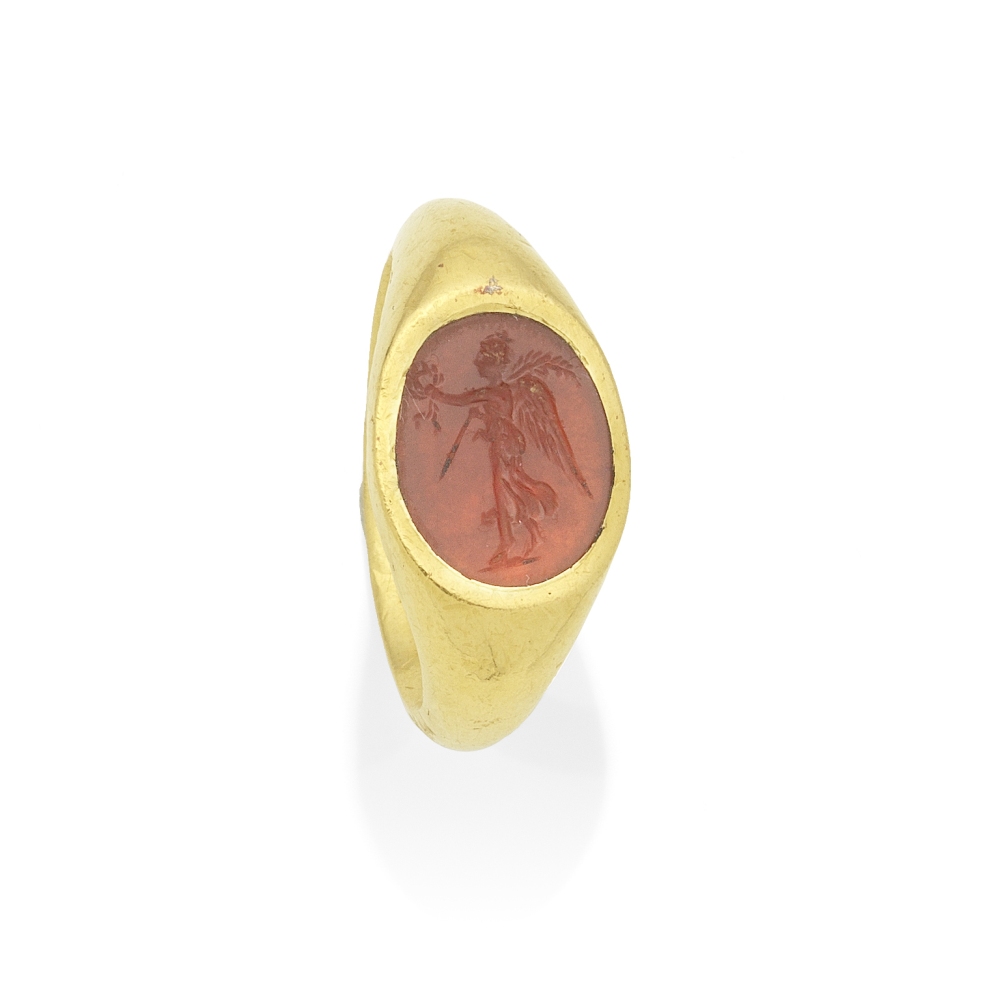 A Roman gold and carnelian intaglio ring with Nike