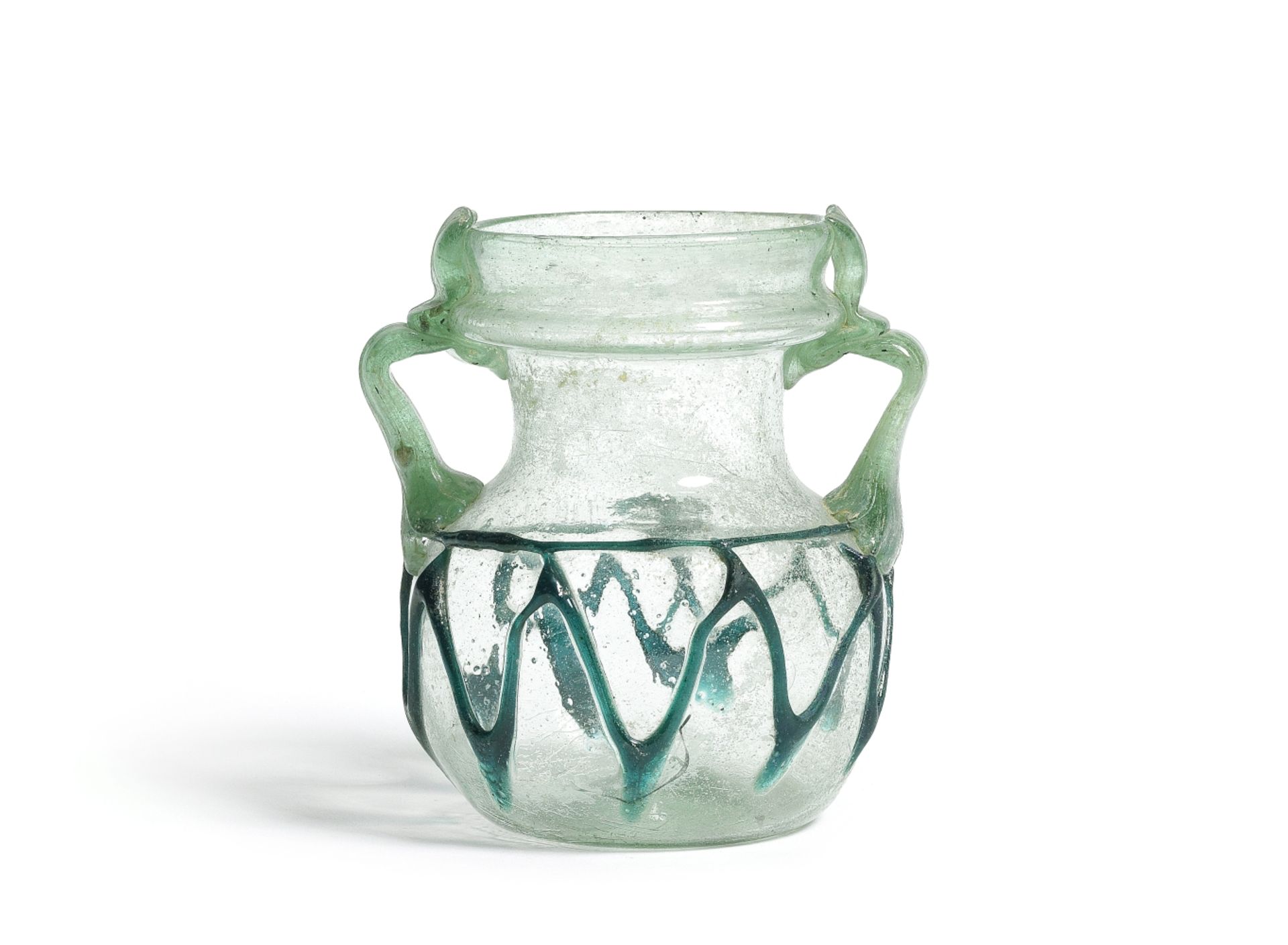A Roman green glass jar