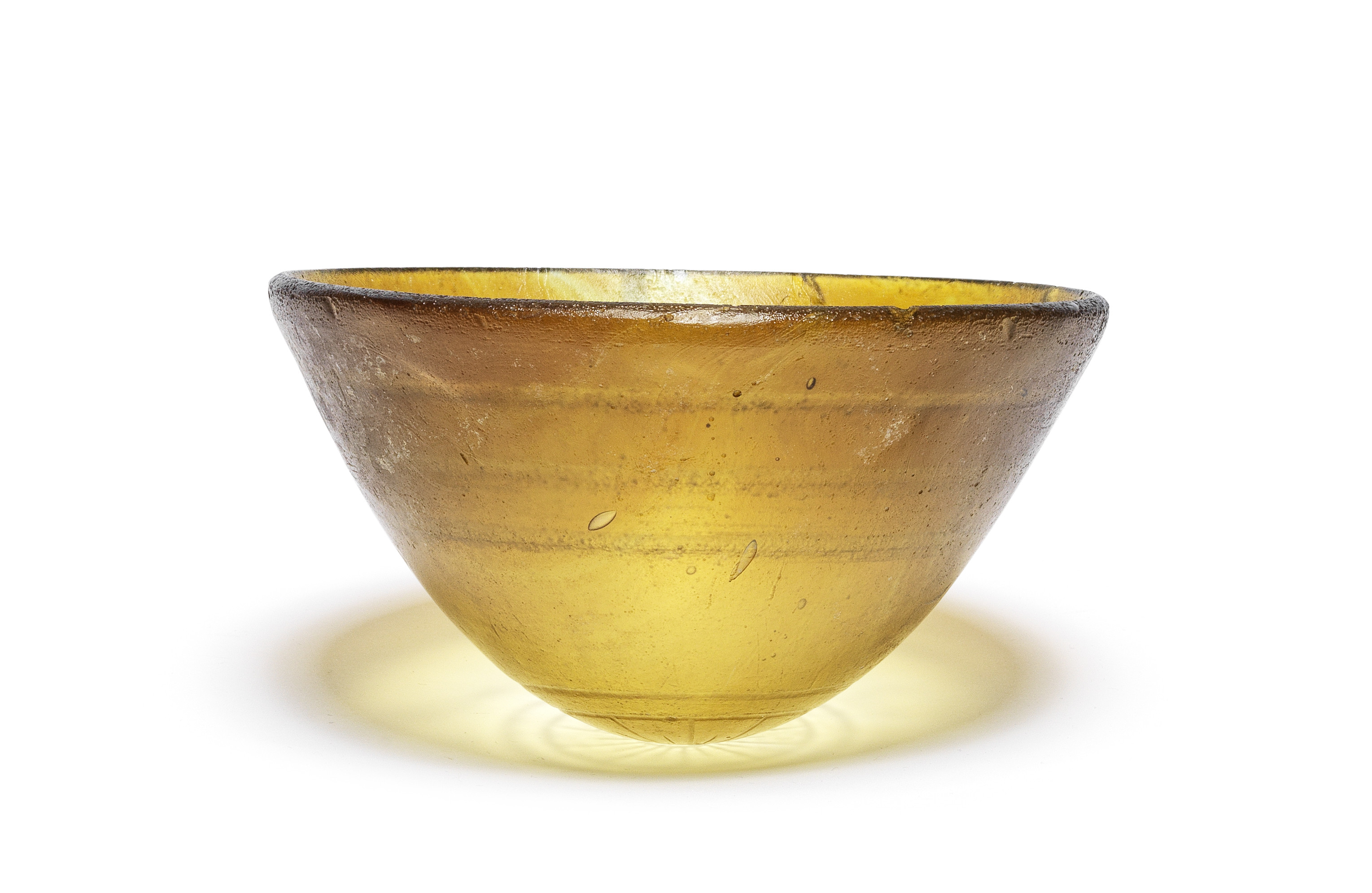 A Hellenistic cast amber glass mammiform bowl