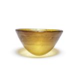 A Hellenistic cast amber glass mammiform bowl
