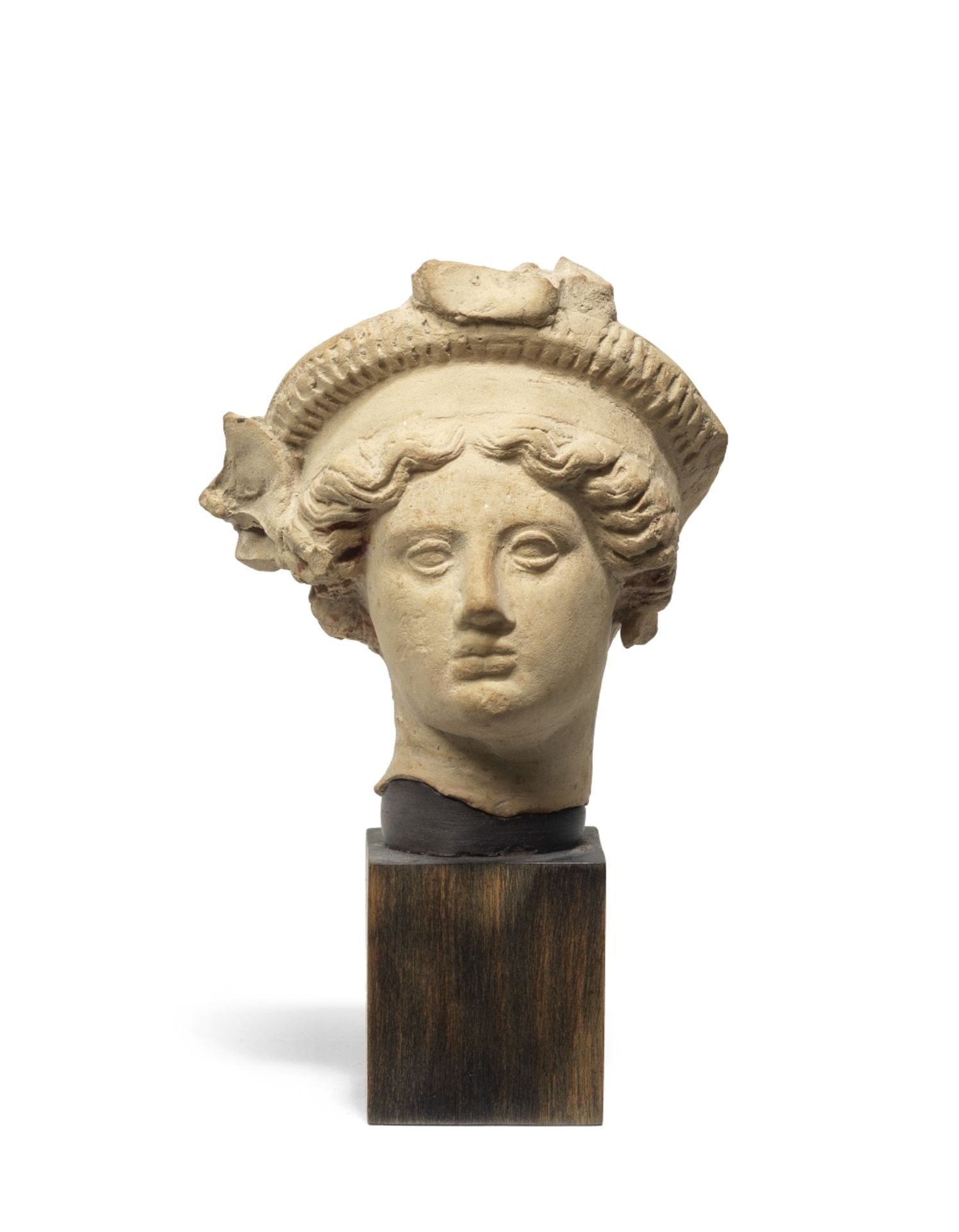 A Greek terracotta head of a youth