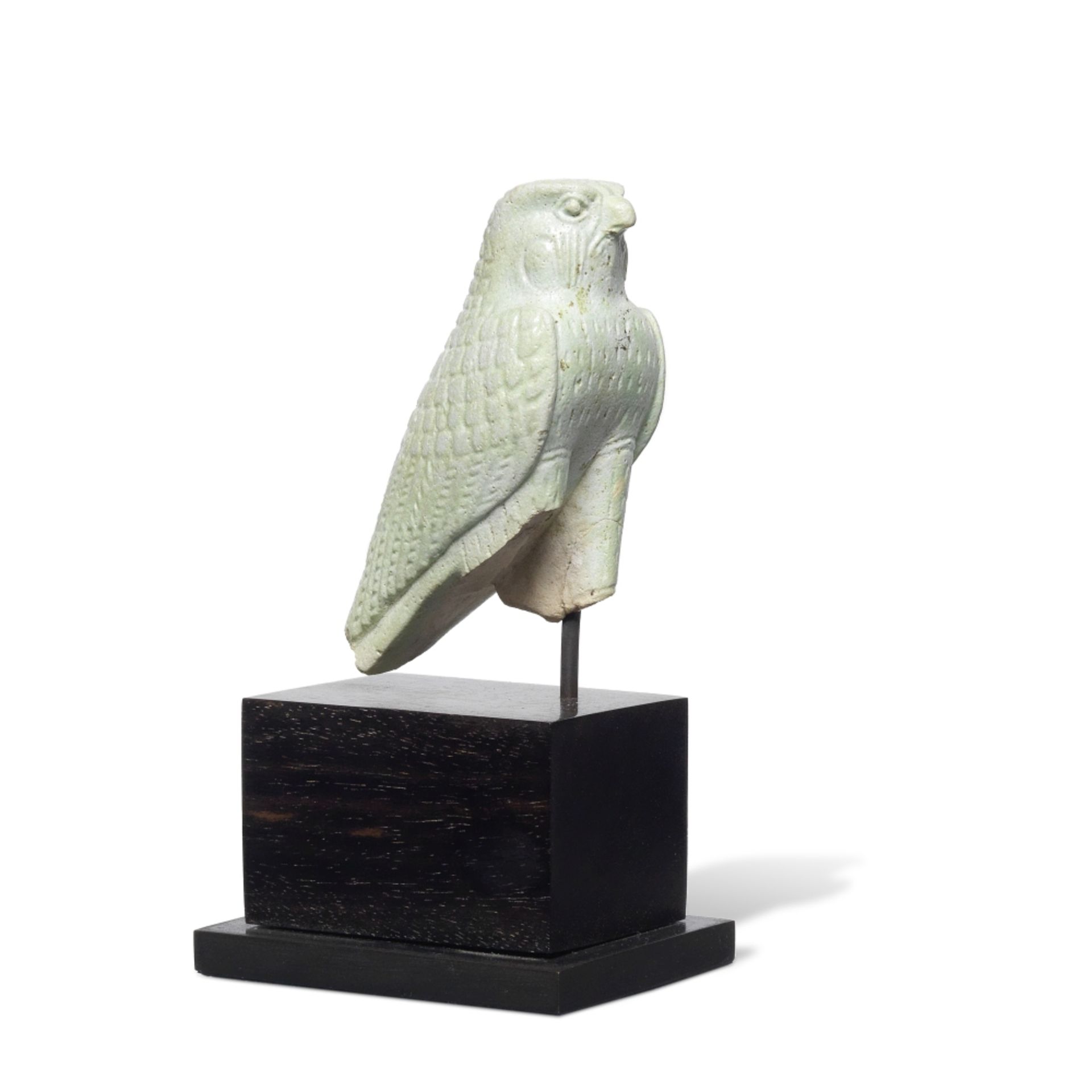 An Egyptian green glazed faience figure of a falcon