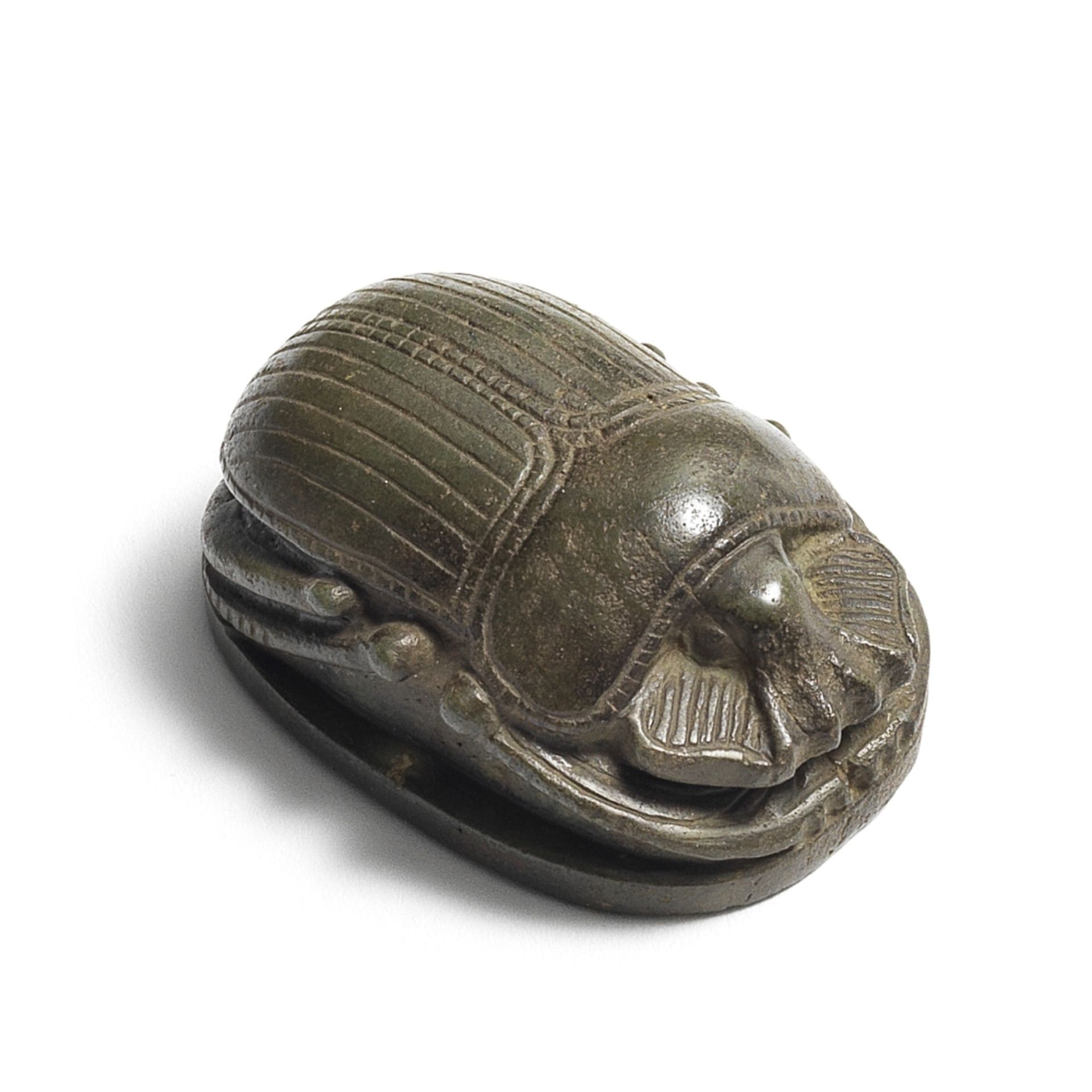 An Egyptian serpentine heart scarab