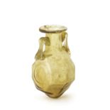 A Roman pale amber glass octagonal amphoriskos