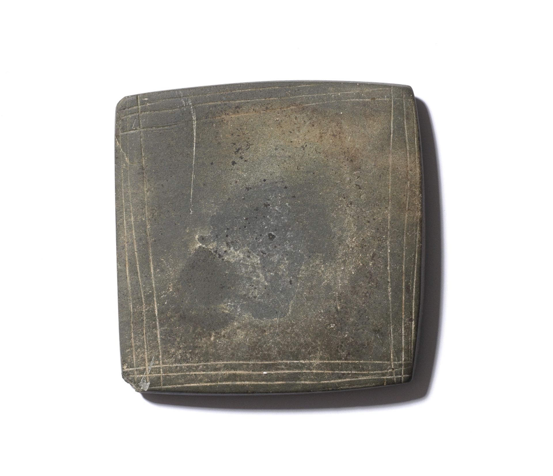 An Egyptian square greywacke palette