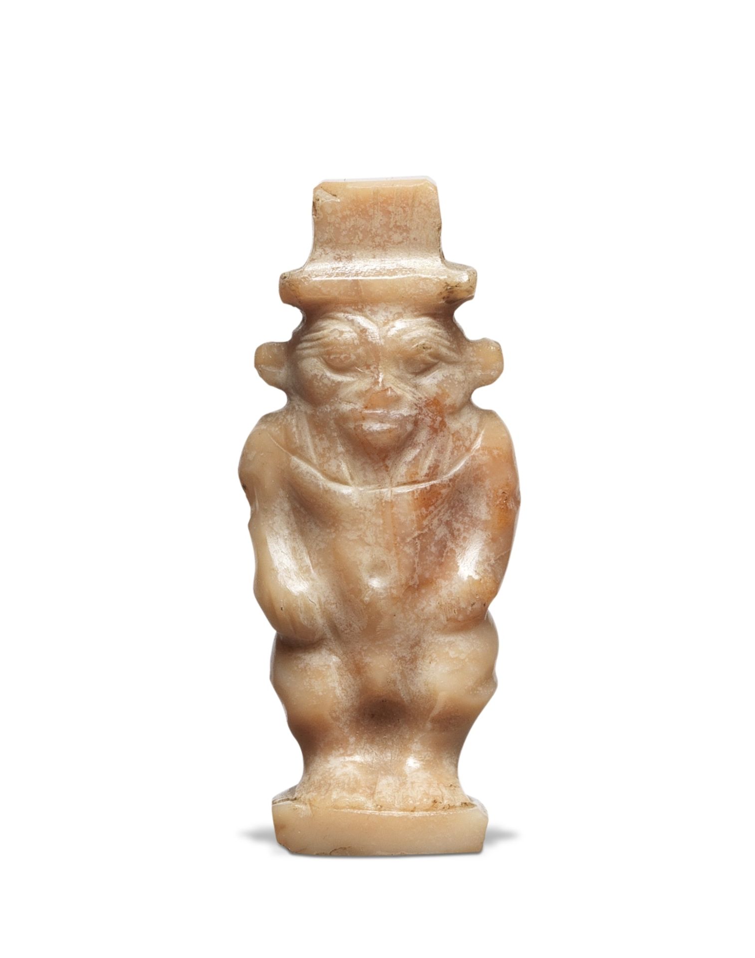 A small Egyptian carnelian amulet of Bes