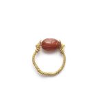 An Etruscan gold and carnelian scarab swivel ring