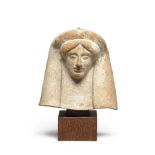 A Greek terracotta protome of a woman