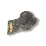 An Egyptian black stone fragmentary pectoral with central scarab element