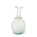 A Roman pale green glass grape flask