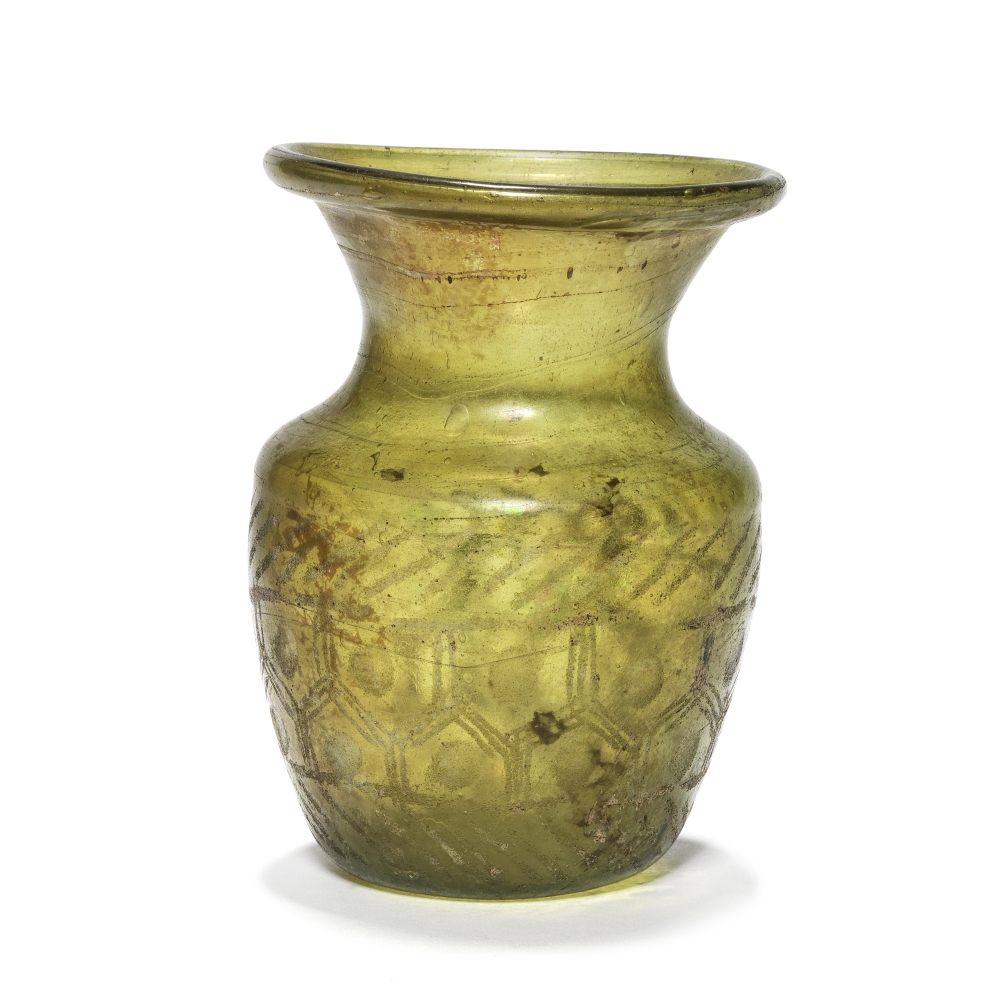 A Roman dark olive green glass wheel-cut jar