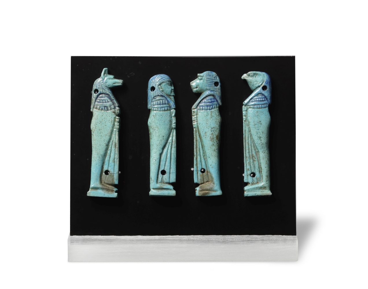 A set of four Egyptian turquoise glazed faience Four Sons of Horus