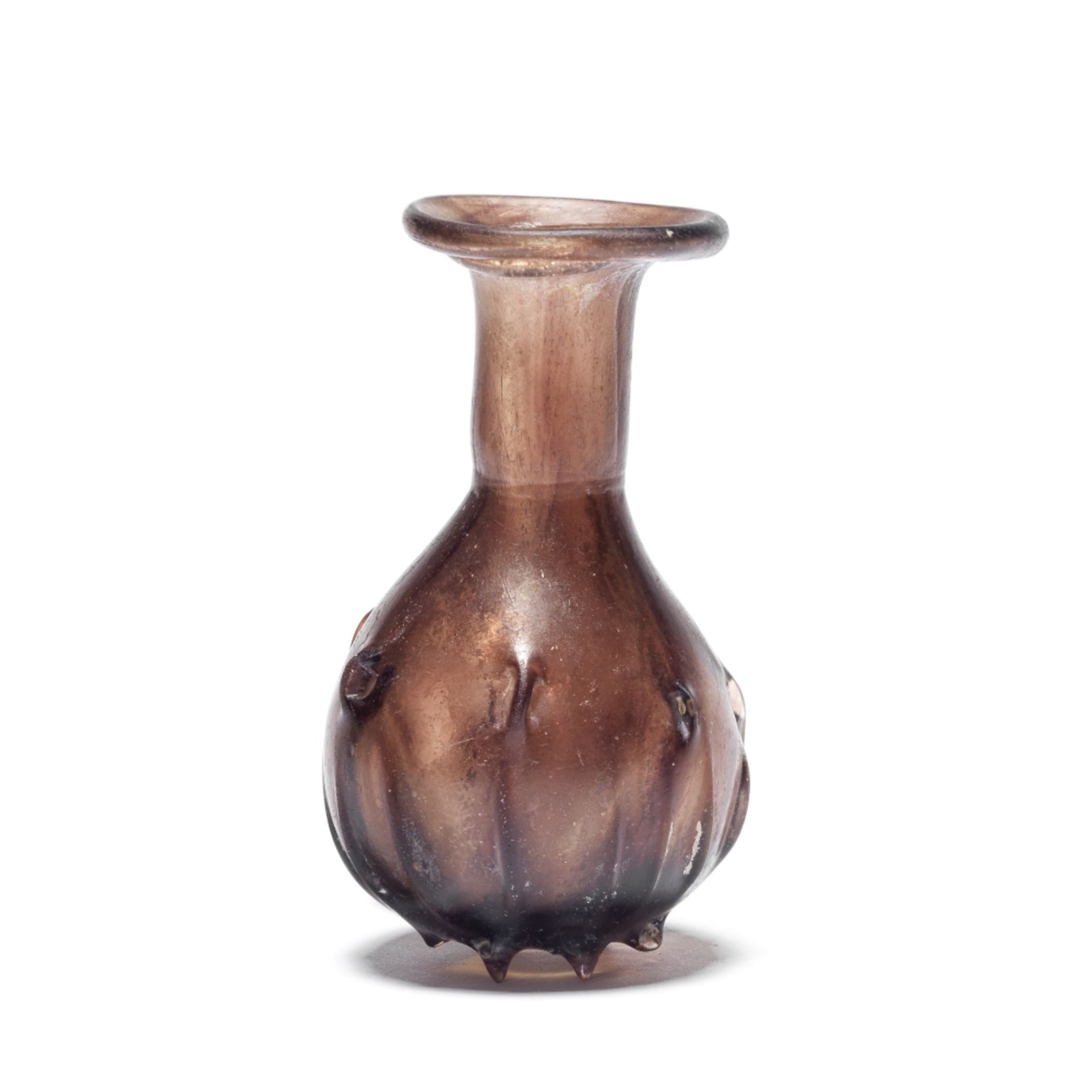 A Roman aubergine glass flask