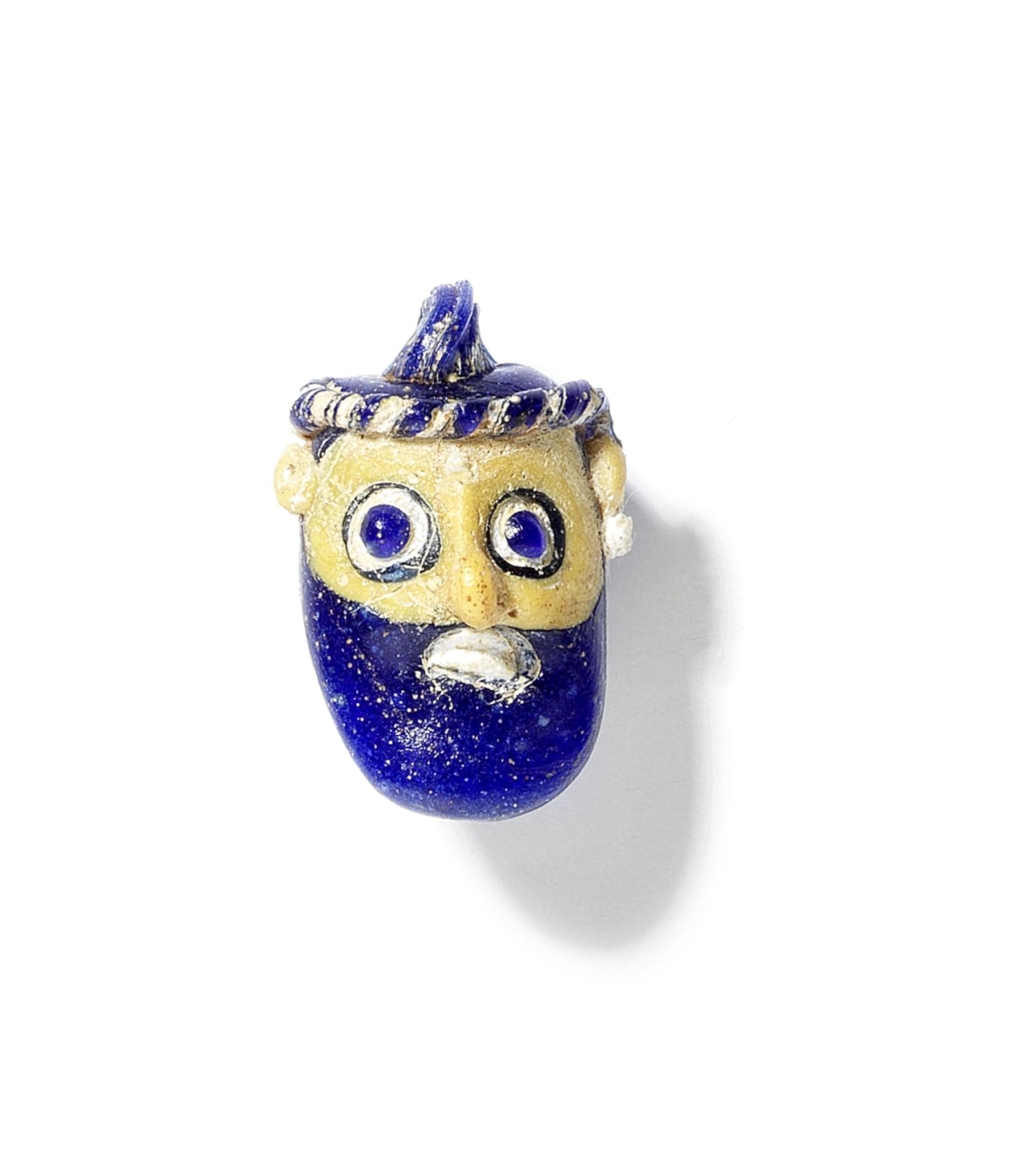 A Phoenician glass head pendant