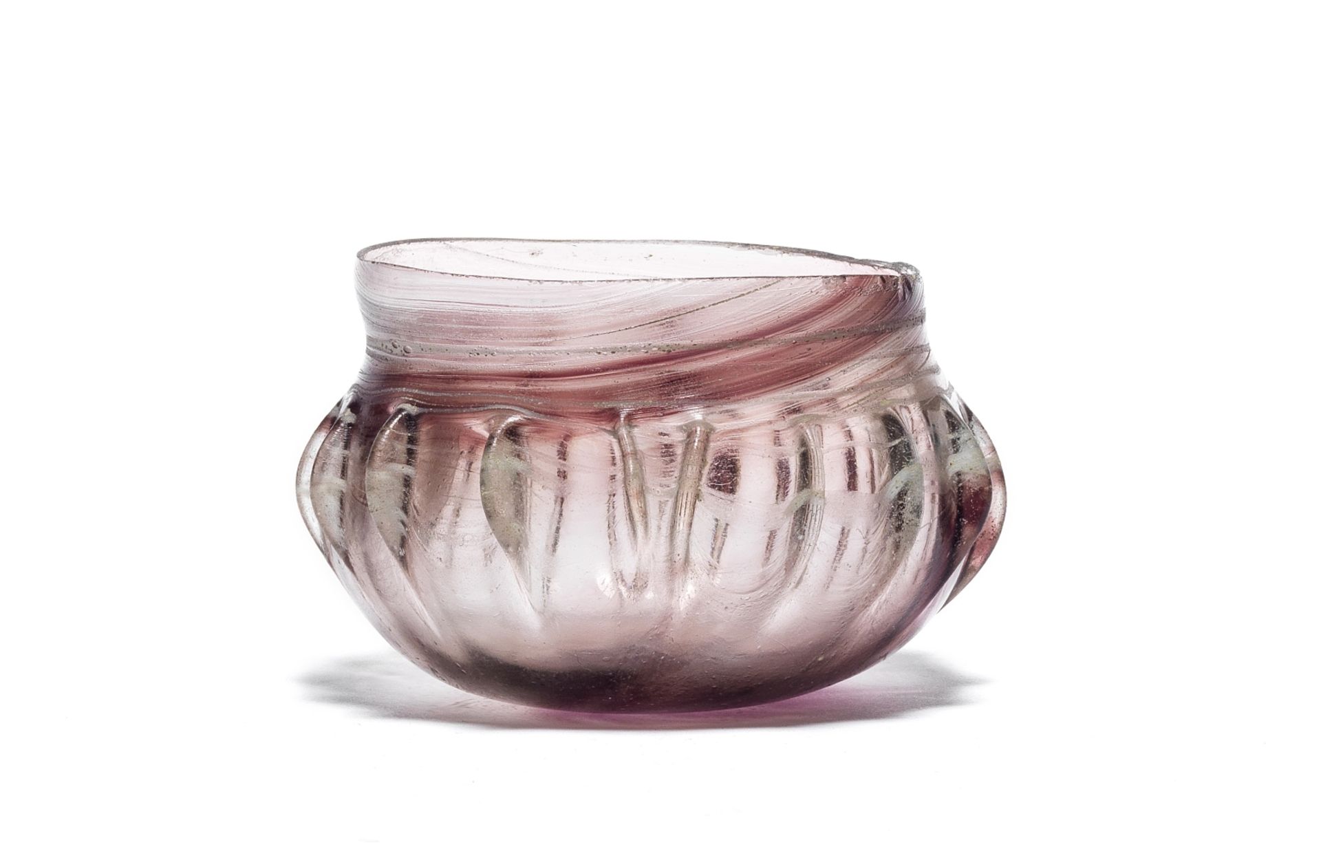 A Roman streaky purple glass ribbed bowl