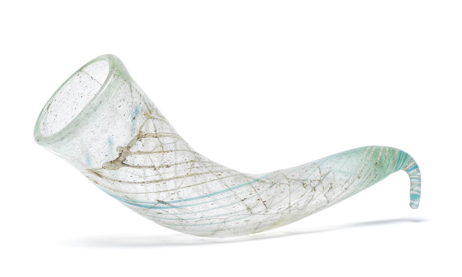 A Roman pale green glass drinking horn