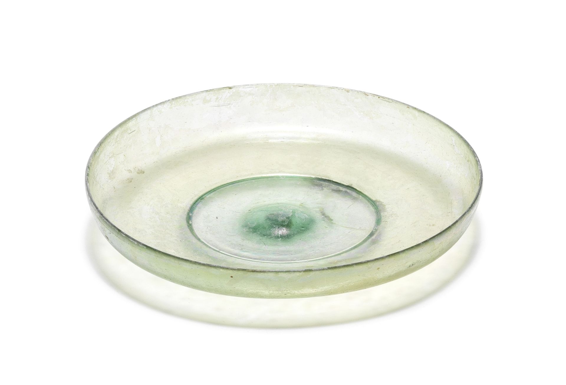 A Roman pale green glass footed dish