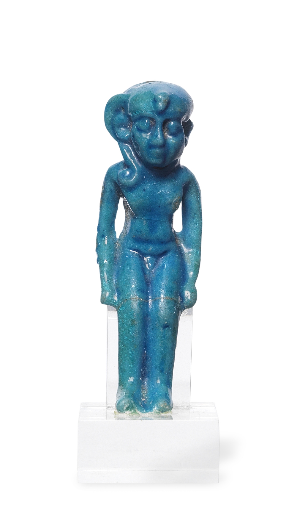 An Egyptian turquoise blue glazed faience amulet of Horus the Child