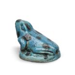 An Egyptian blue glazed faience amuletic frog with black spots