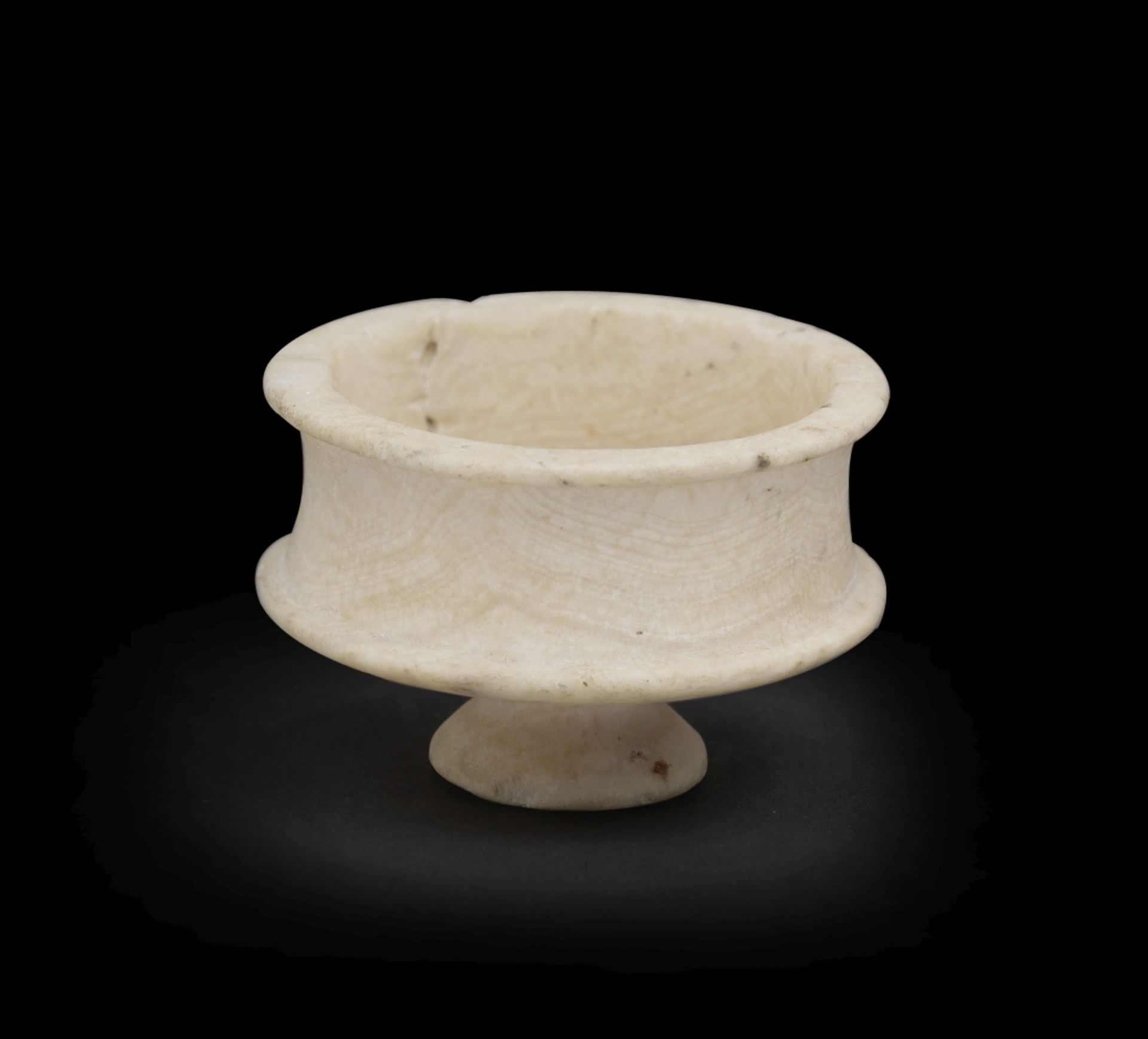 A small Egyptian travertine footed cup 'tazza'