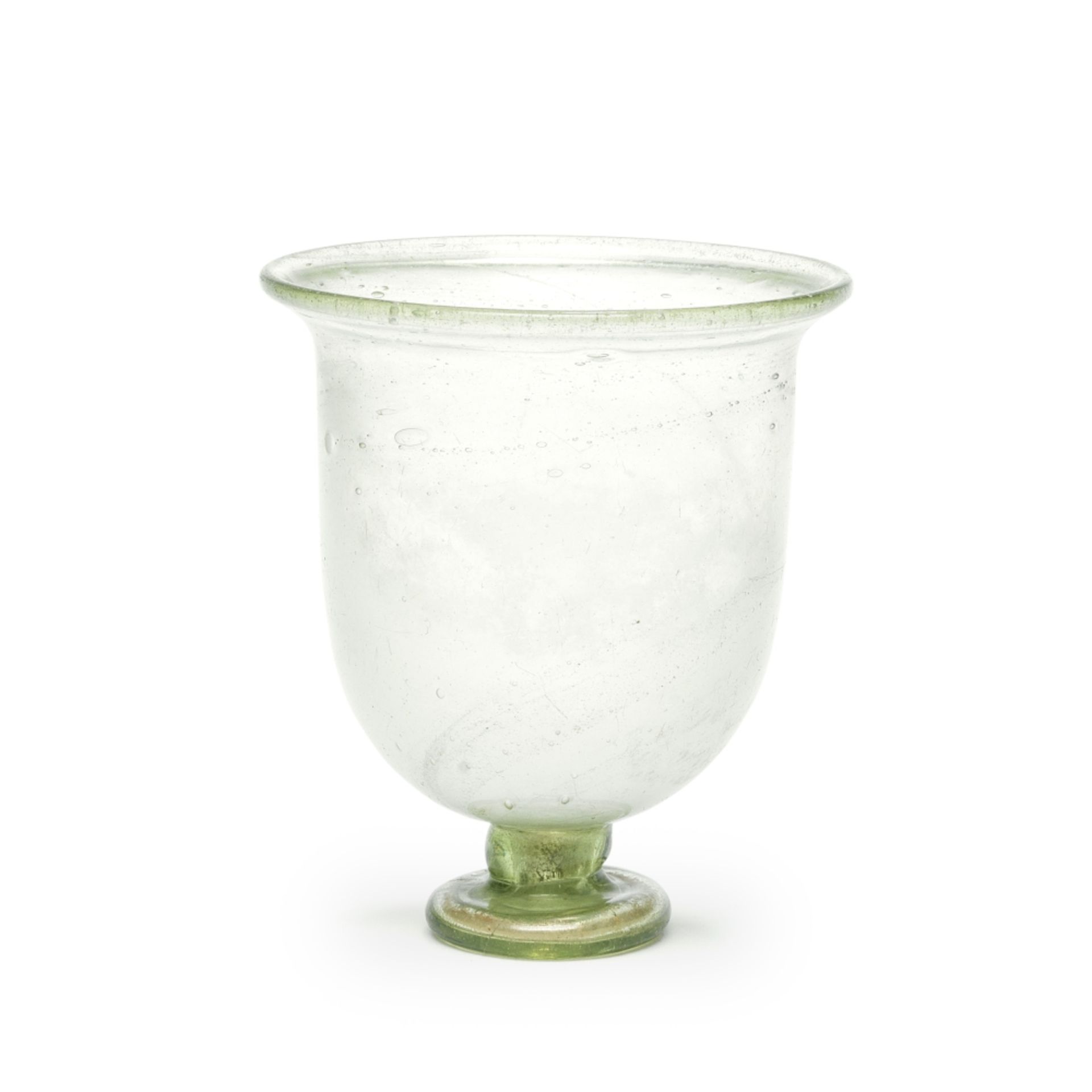 A Roman green glass goblet