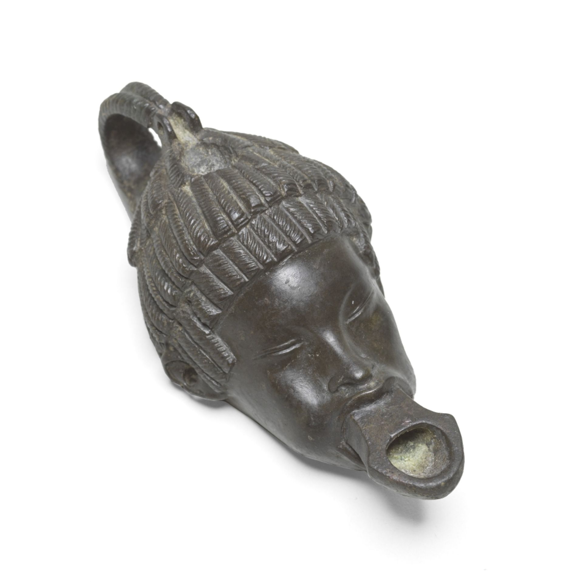A Roman bronze lamp in the form of the head of an African